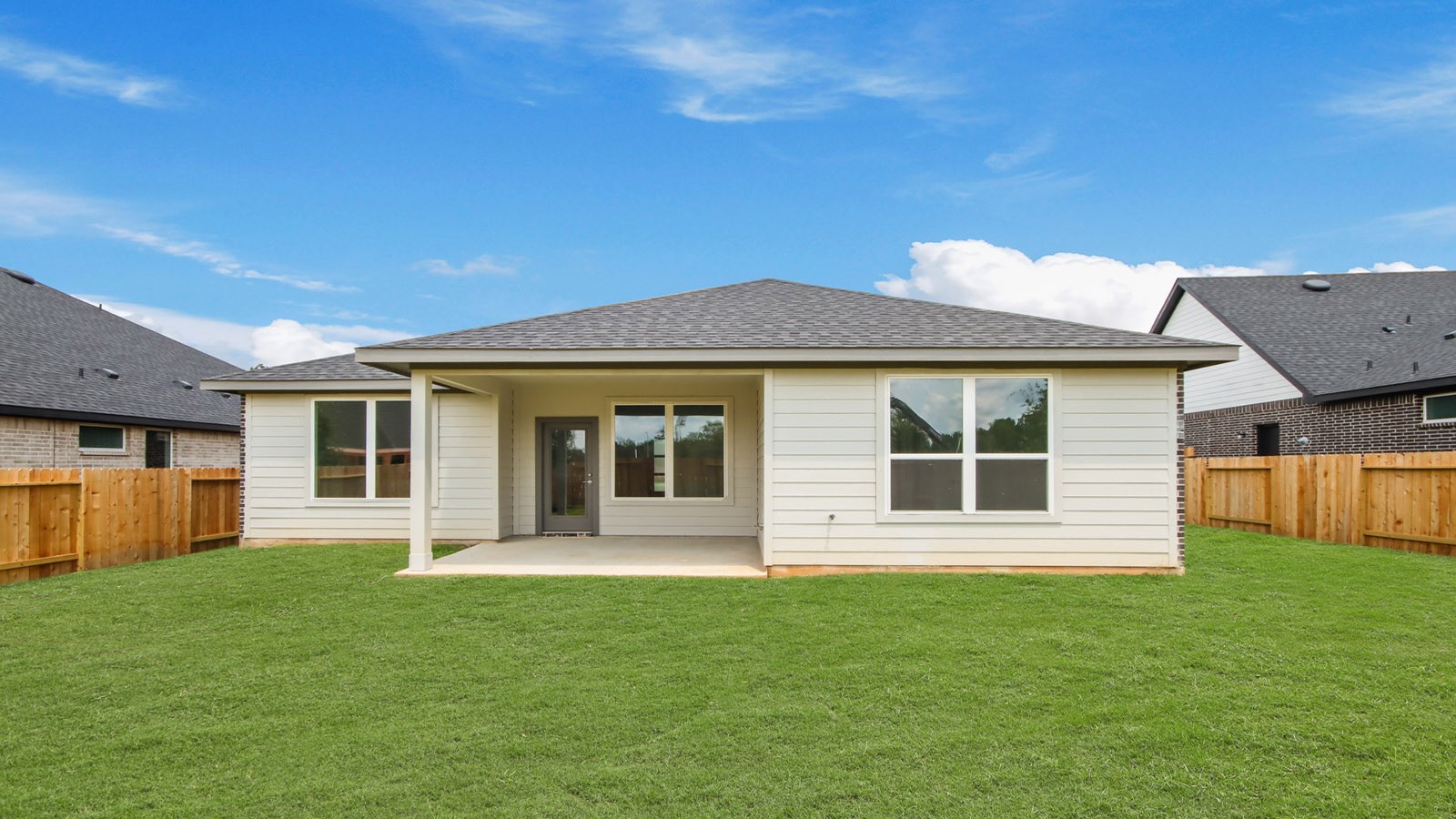 4436 Wapama Falls Loop Conroe, TX 77303 - Photo 3 of 39 a front view of a house with a garden