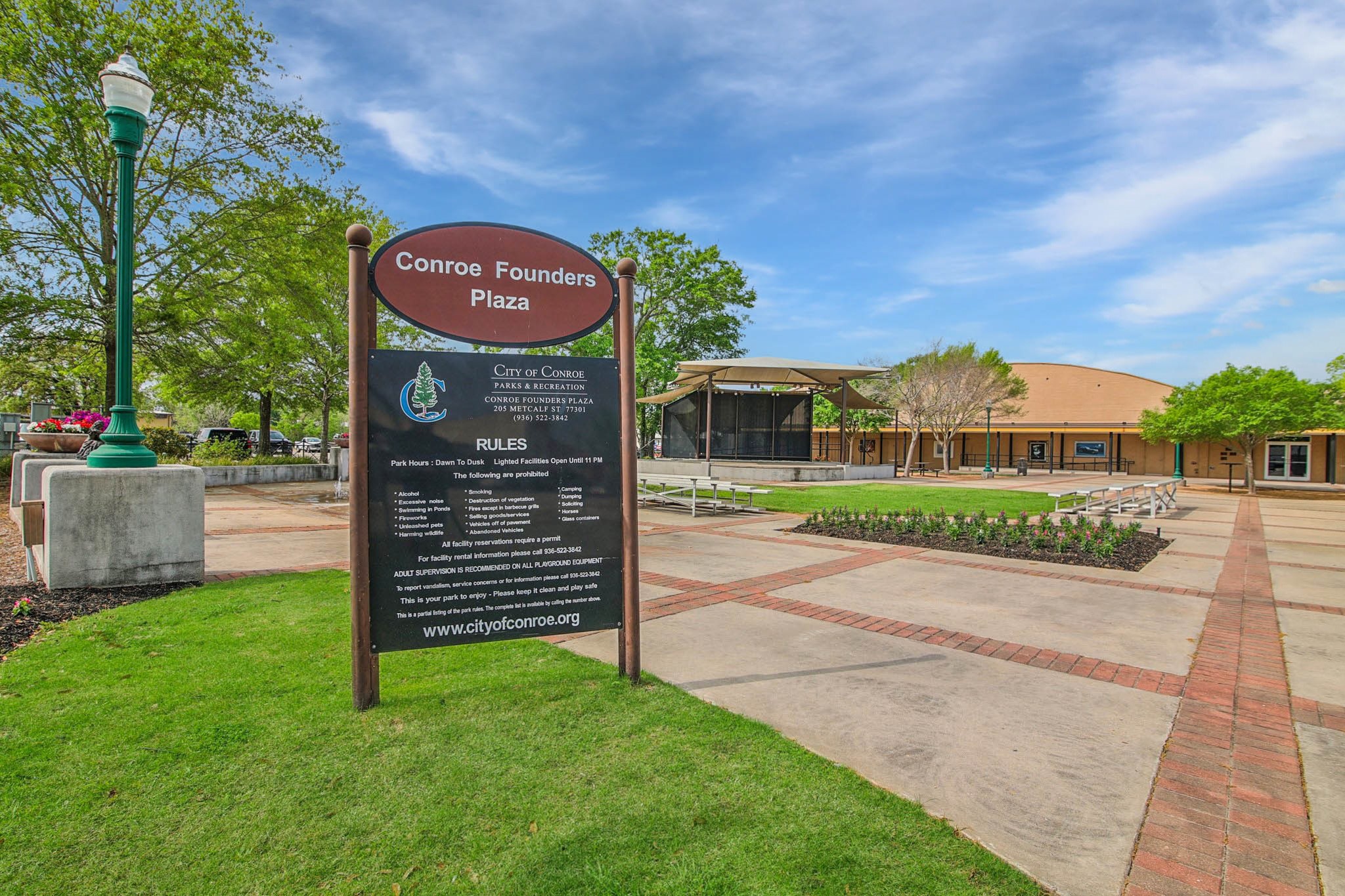 4436 Wapama Falls Loop Conroe, TX 77303 - Photo 31 of 39 a front view of a house with a garden
