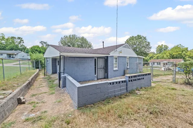 a view of a room with wooden floor and white walls