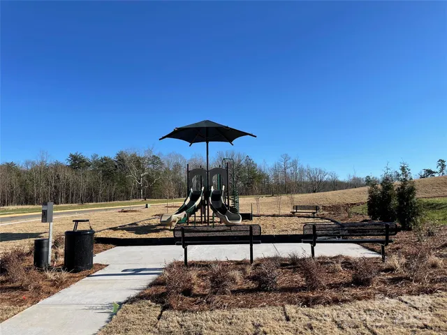 a view of a lake with a yard