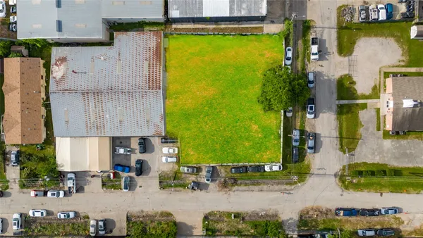 an aerial view of a house with a swimming pool