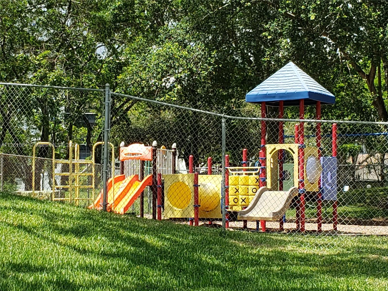 Cypress Bend Pompano Beach, FL 33069 - Photo 17 of 31 a front view of house with swing and slide