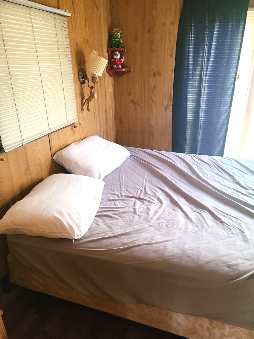 28-142 Woodhaven Sublette, IL 61367 - Photo 10 of 17 a bedroom with a bed and a window
