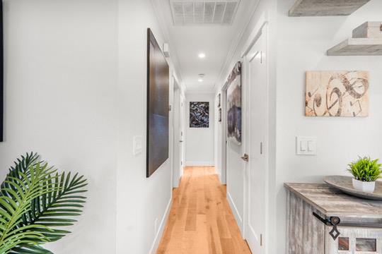 1364 Bouret Drive San Jose, CA 95118 - Photo 11 of 35 a view of a hallway with wooden floor and closet