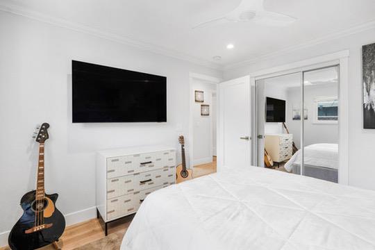 1364 Bouret Drive San Jose, CA 95118 - Photo 16 of 35 a bedroom with a bed and a flat screen tv