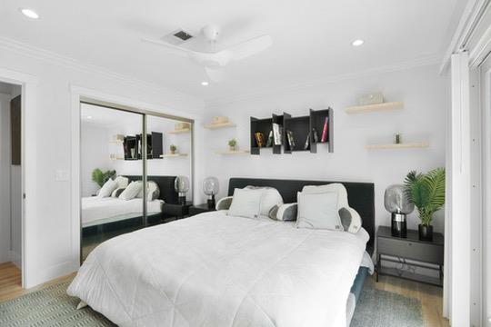 1364 Bouret Drive San Jose, CA 95118 - Photo 18 of 35 a bedroom with a large bed and wooden floor