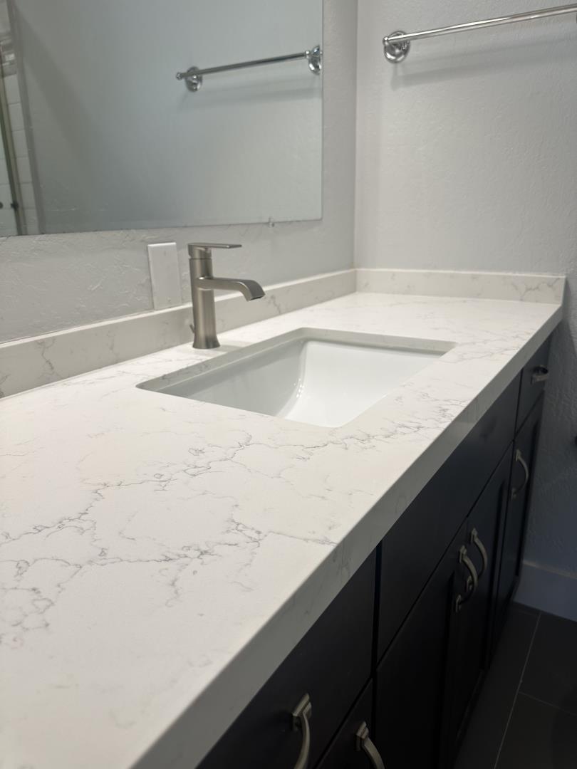 1364 Bouret Drive San Jose, CA 95118 - Photo 20 of 35 a close view of a sink and a vanity in bathroom