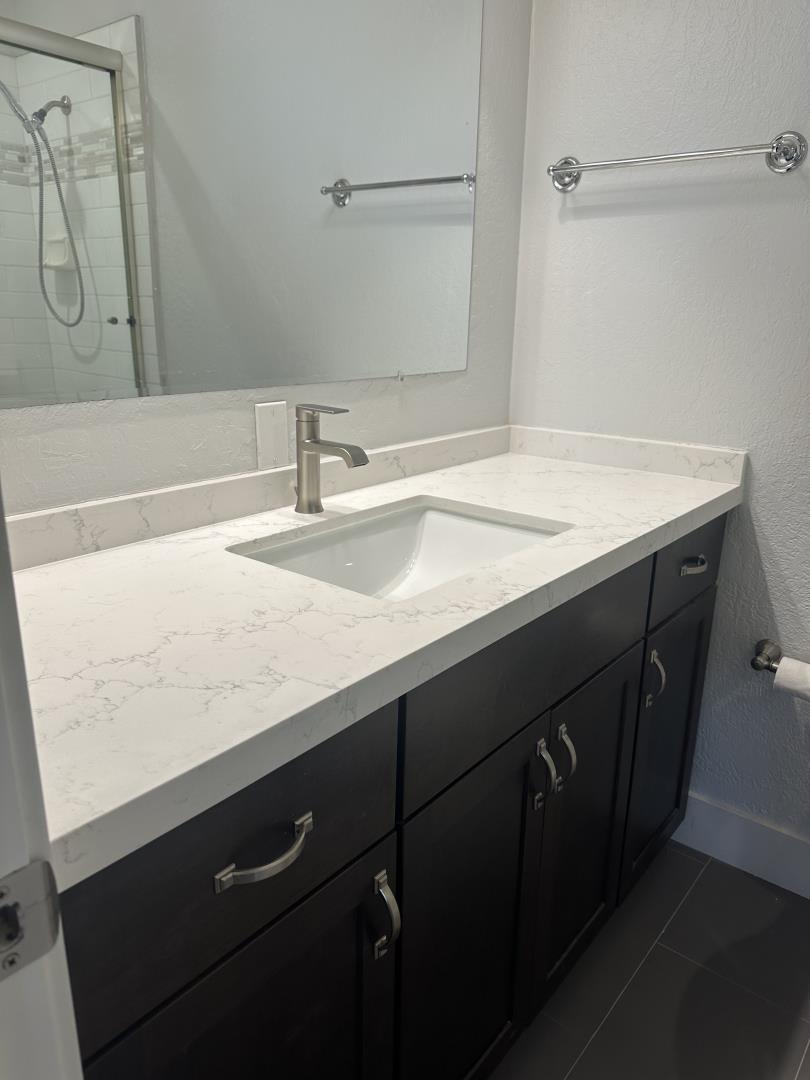 1364 Bouret Drive San Jose, CA 95118 - Photo 21 of 35 a bathroom with a sink and a mirror