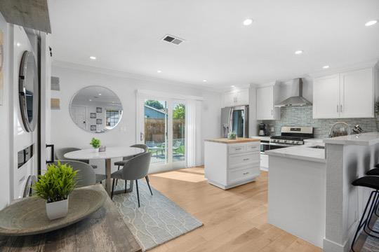 1364 Bouret Drive San Jose, CA 95118 - Photo 9 of 35 a kitchen with a dining table chairs and refrigerator