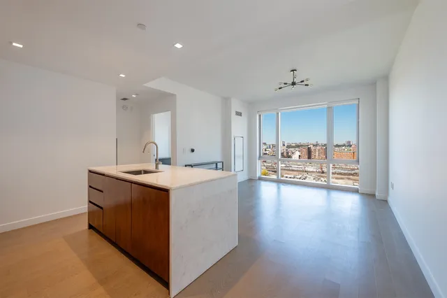 a view of a kitchen with a sink and a stove top oven