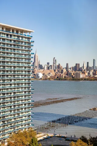 a view of ocean with a multi story building