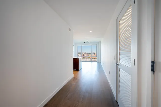 a view of hallway with washer and dryer