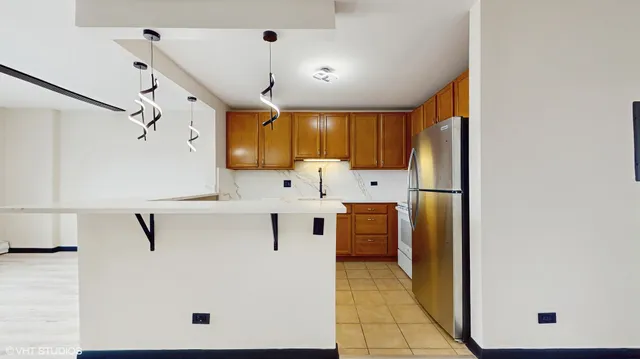 a view of a kitchen with electric appliances