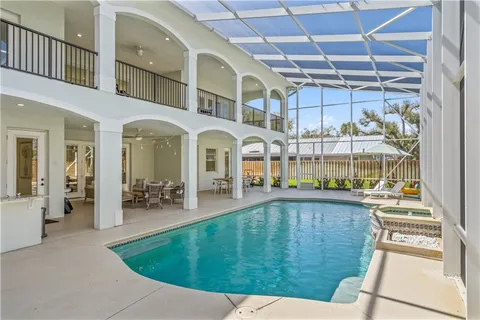 a view of swimming pool with outdoor seating