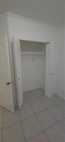 an empty room with a bench