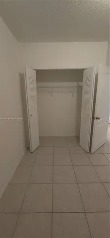 a view of room with refrigerator