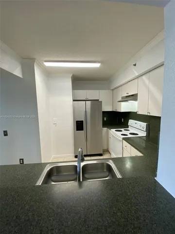 a view of a street with a big yard