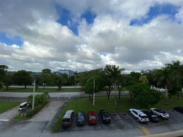 a view of a hallway with a chandelier