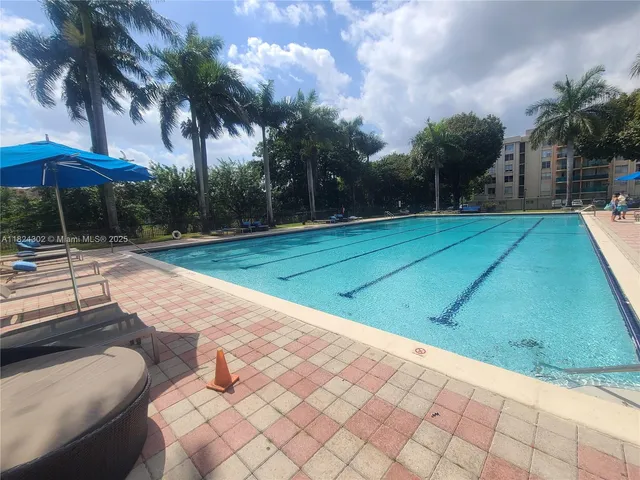 a view of a swimming pool with a patio
