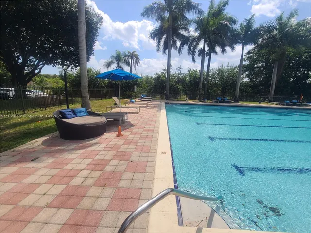 a view of outdoor space with swimming pool and patio