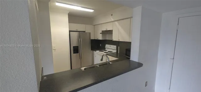 a view of a hallway with workspace