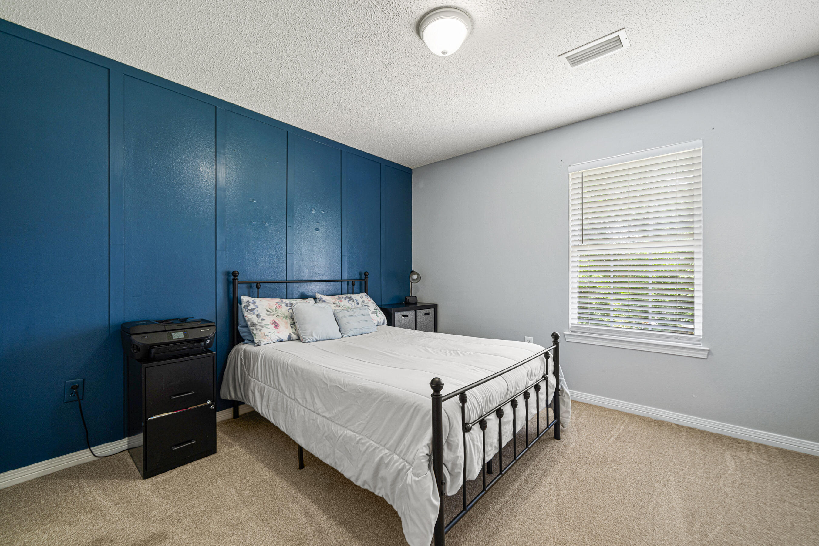 138 Conquest Avenue Crestview, FL 32536 - Photo 22 of 34 a bedroom with a bed and a window