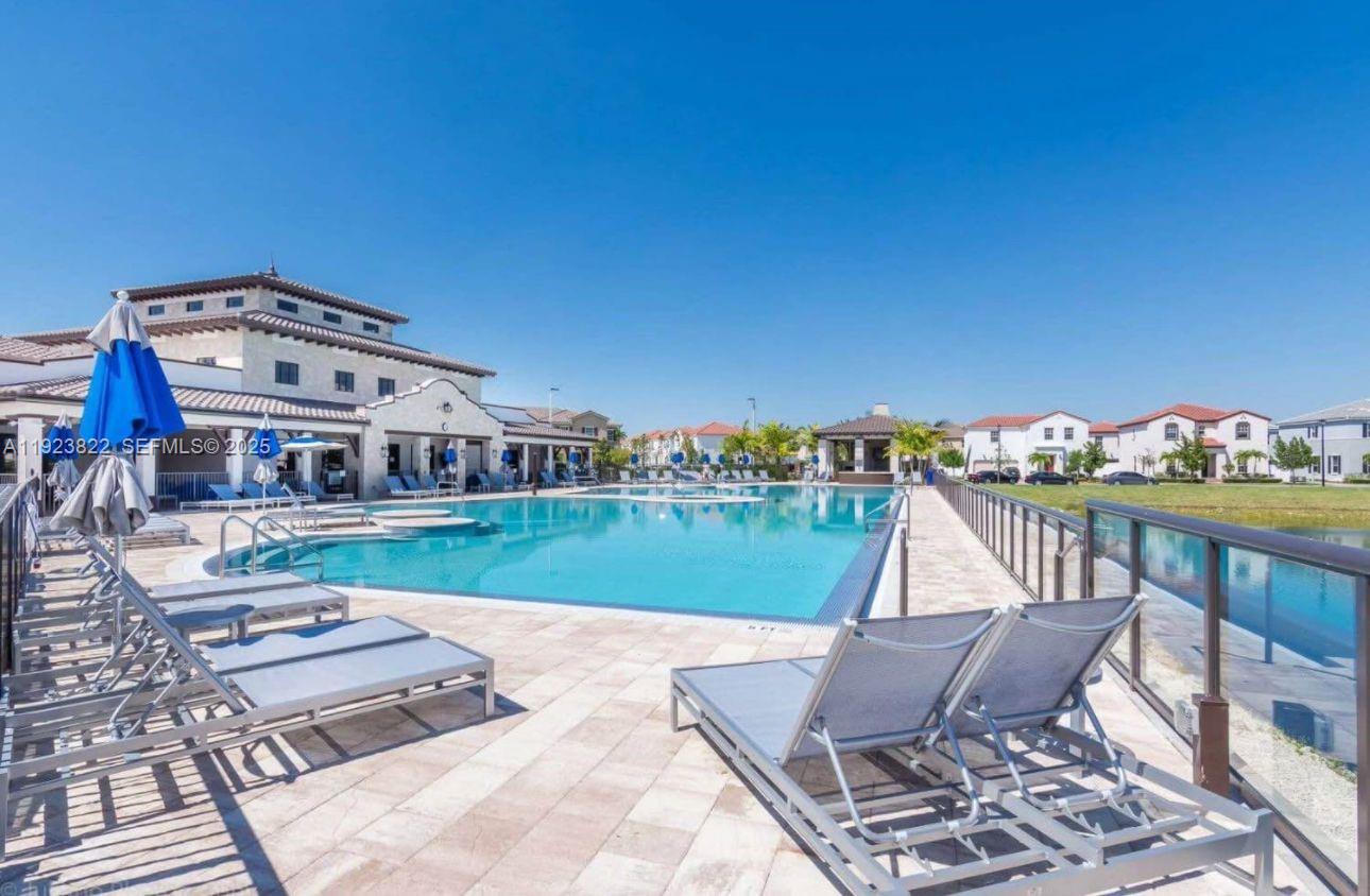9401 Southwest 172nd Avenue, Unit STUDIO Miami, FL 33196 - Photo 10 of 12 a view of a chairs and table on the terrace