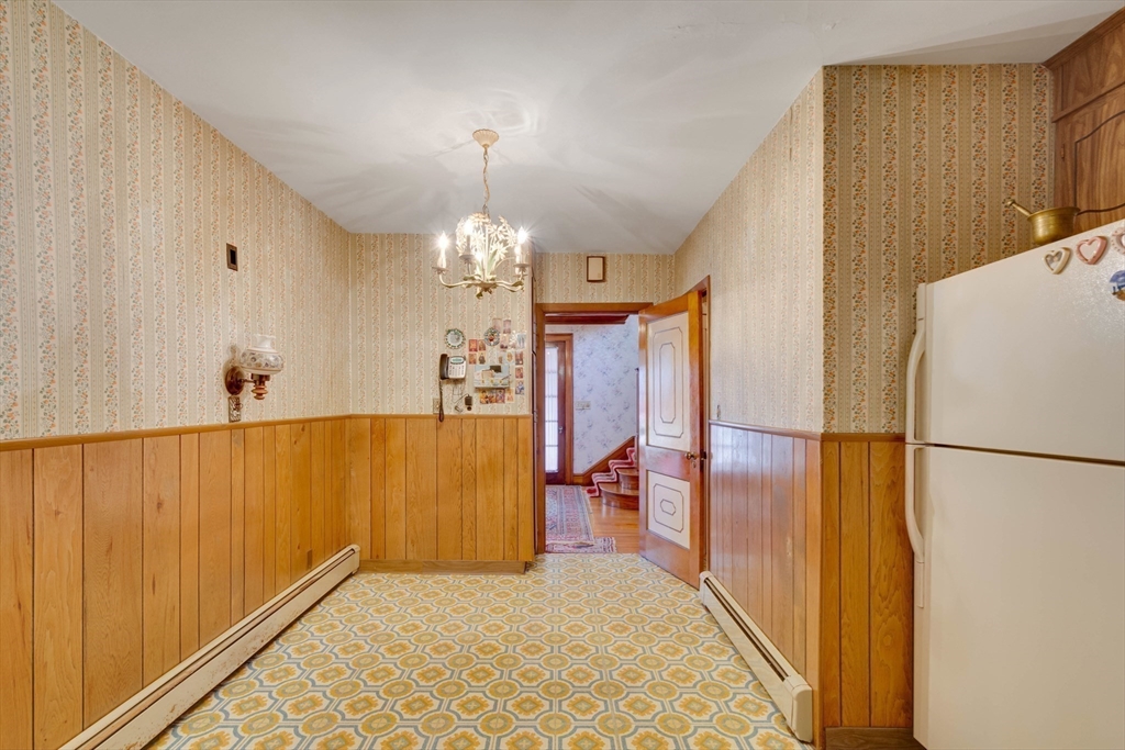 83 Bartlett Avenue Arlington, MA 02476 - Photo 12 of 22 a view of a livingroom with furniture and a hallway