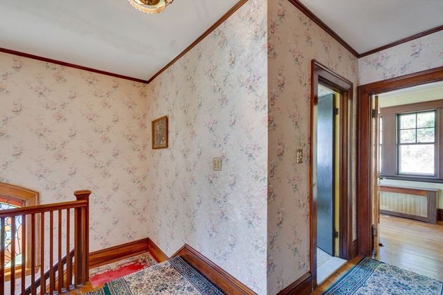 a view of a hallway with entryway door