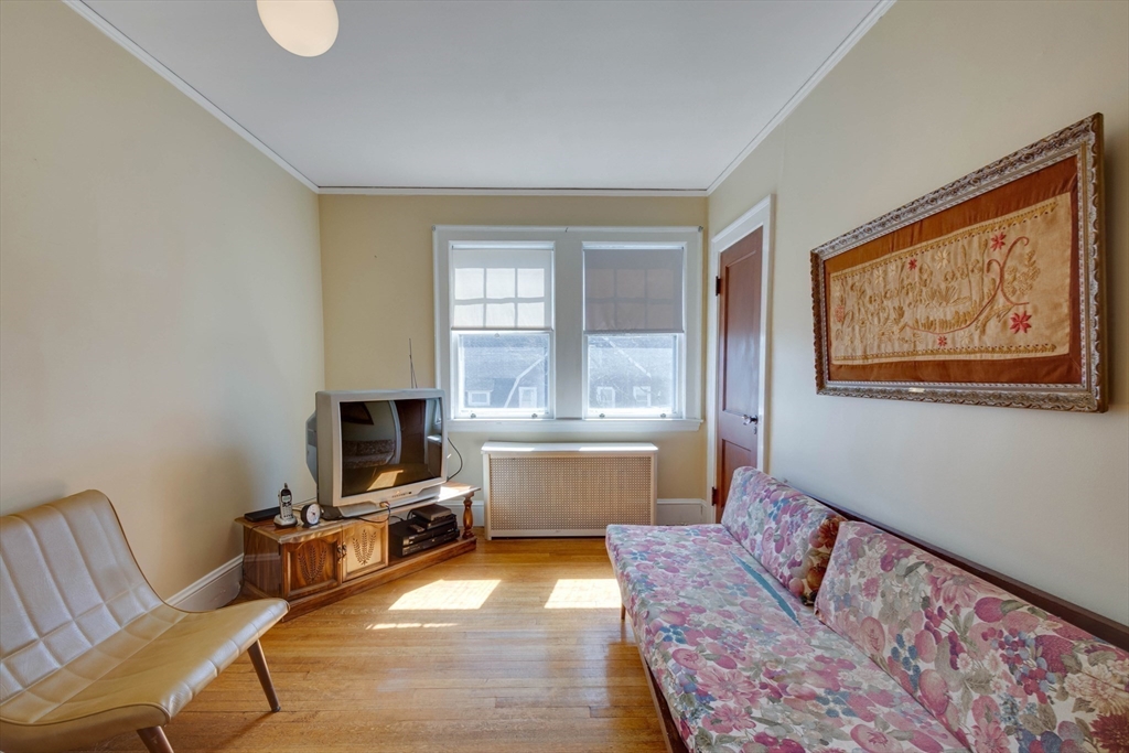 83 Bartlett Avenue Arlington, MA 02476 - Photo 15 of 22 a living room with furniture and a window