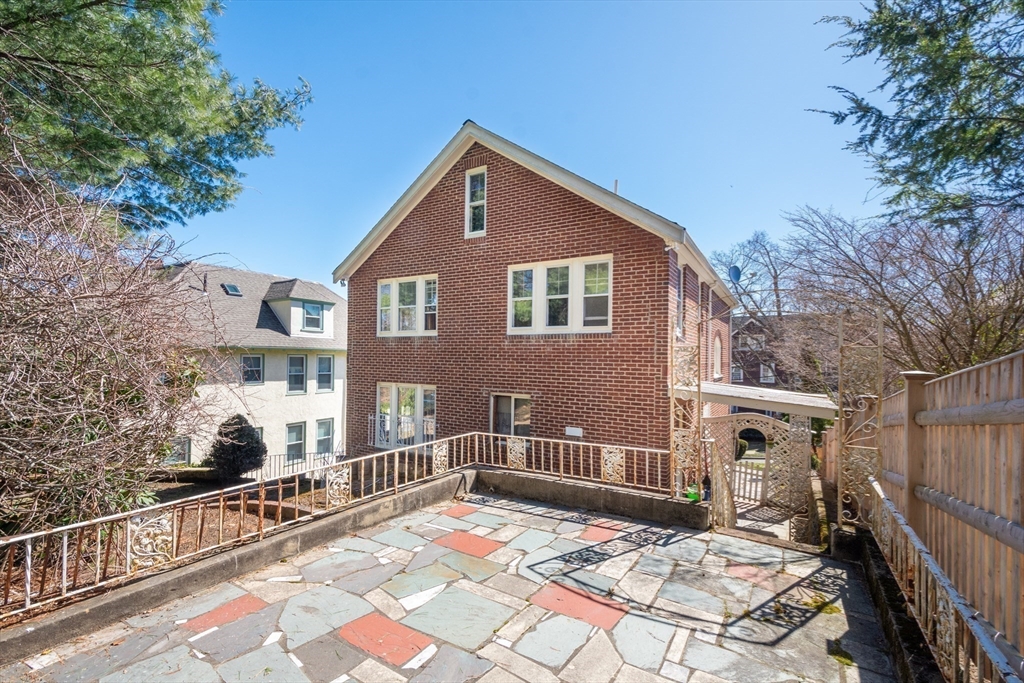 83 Bartlett Avenue Arlington, MA 02476 - Photo 21 of 22 a front view of a house with a yard
