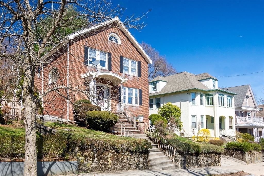 83 Bartlett Avenue Arlington, MA 02476 - Photo 22 of 22 a front view of a house with a yard