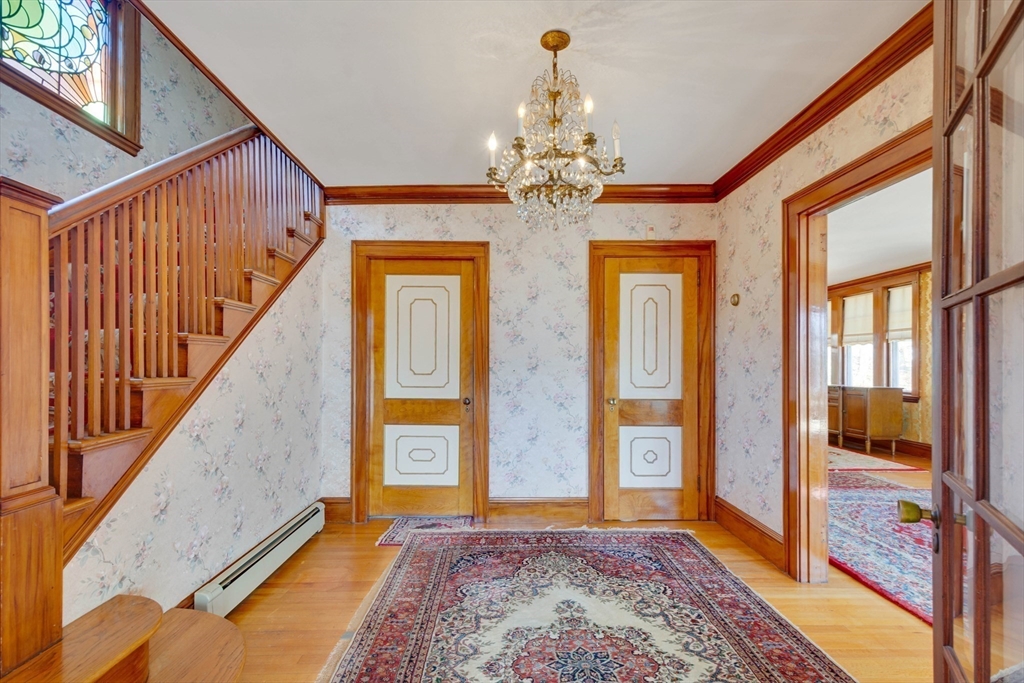 83 Bartlett Avenue Arlington, MA 02476 - Photo 3 of 22 a view of an entryway with a workspace