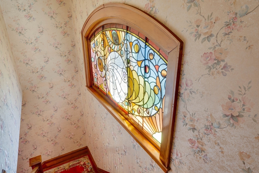 83 Bartlett Avenue Arlington, MA 02476 - Photo 6 of 22 a sign on the wall in front of a wall