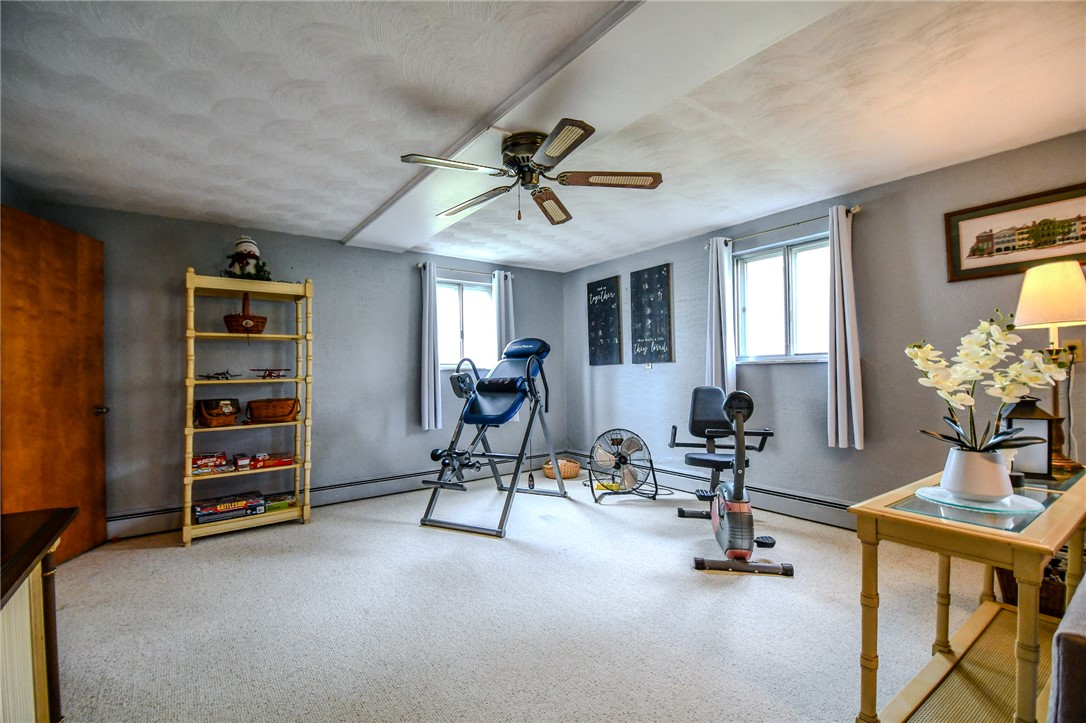 10833 Kendig Road Medway, OH 45341 - Photo 34 of 46 This versatile room offers ample space for various activities, featuring carpet flooring and natural light.