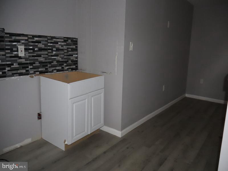 1753 North 27th Street Philadelphia, PA 19121 - Photo 19 of 38 a kitchen with a sink and cabinets
