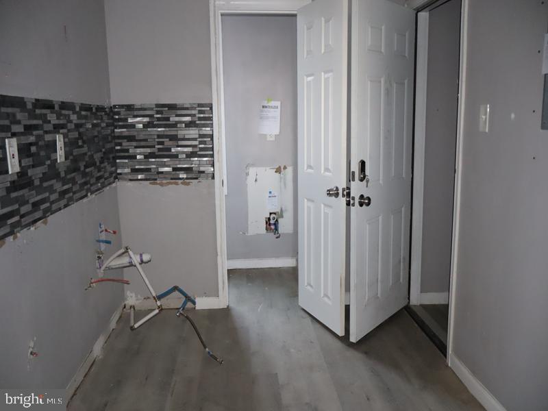 1753 North 27th Street Philadelphia, PA 19121 - Photo 31 of 38 a view of a hallway with wooden floor and closet