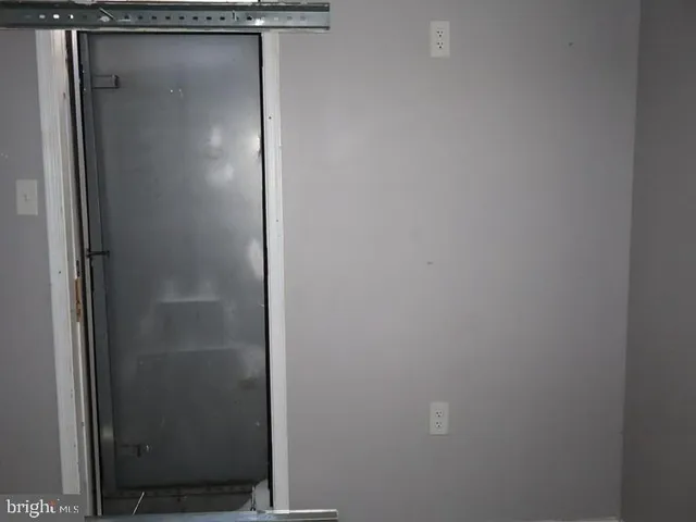 a bathroom with a glass door