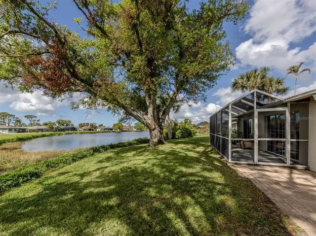 a view of a backyard with a lake view