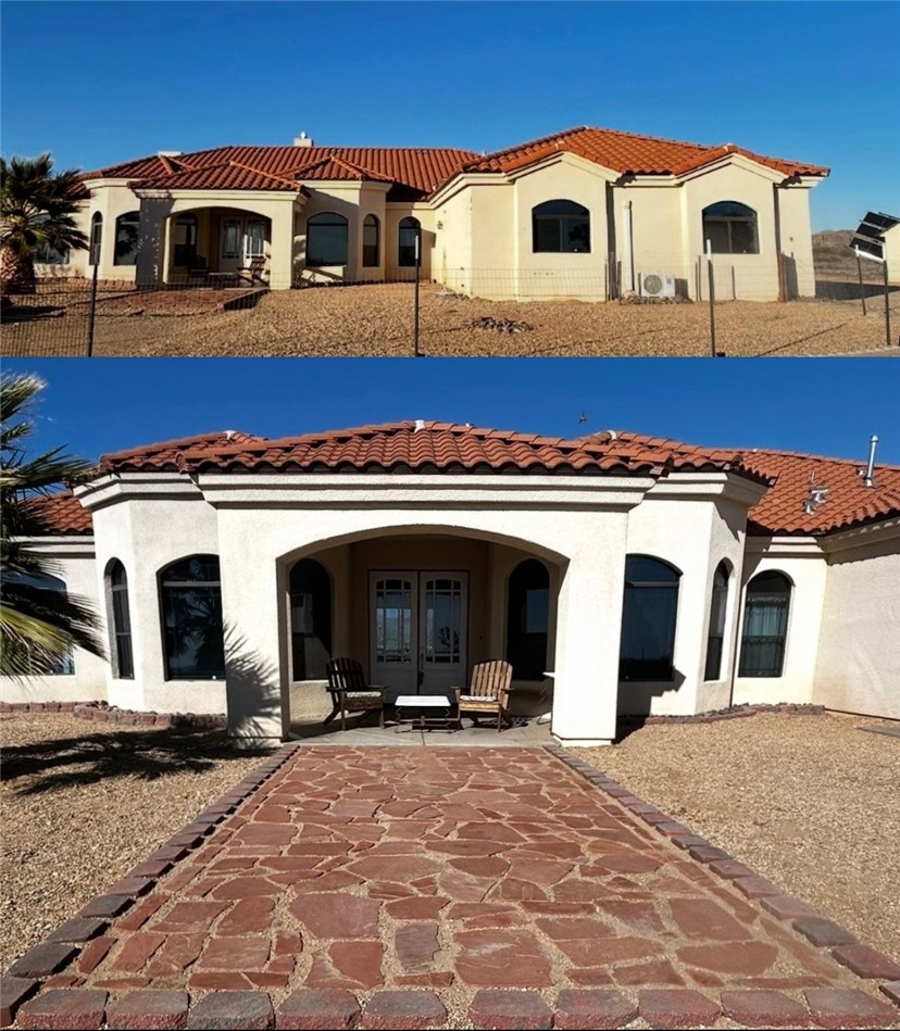 Back of property with french doors, a tiled roof, and stucco siding