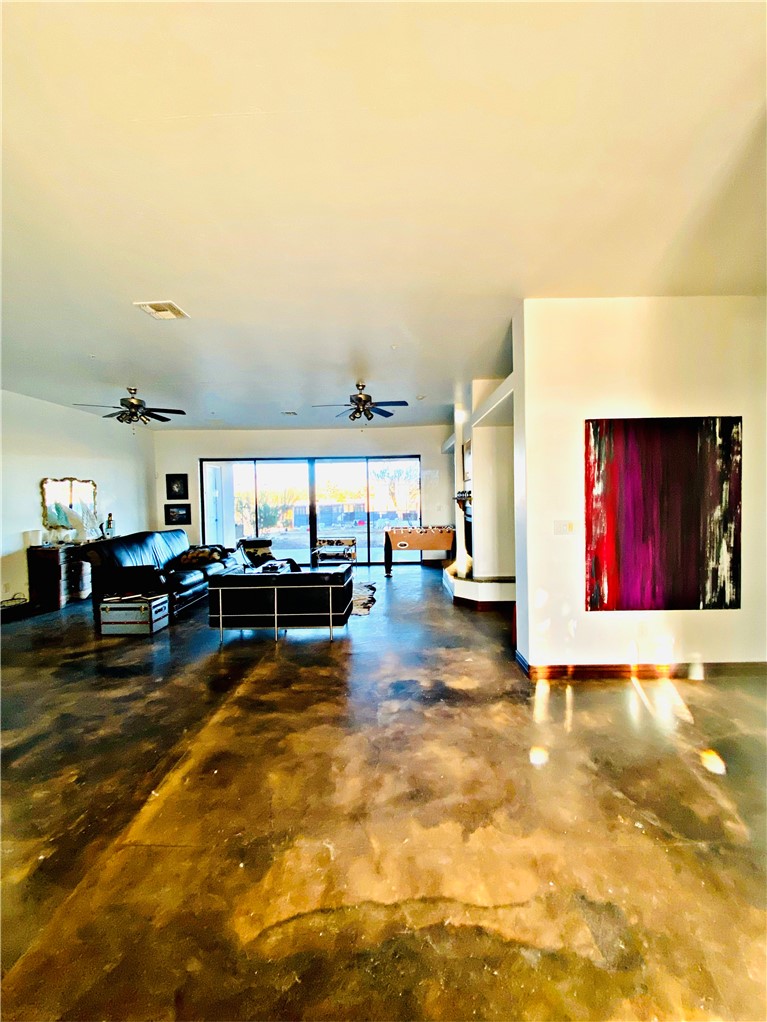 21038 South Cheyenne Road Yucca, AZ 86438 - Photo 16 of 98 Living room featuring ceiling fan