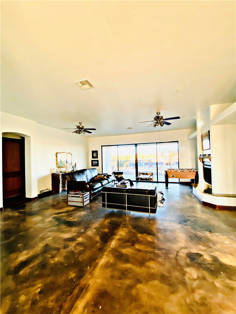 21038 South Cheyenne Road Yucca, AZ 86438 - Photo 18 of 98 Living room with ceiling fan