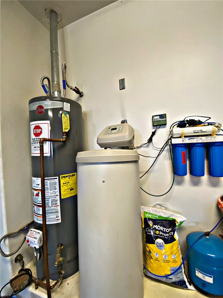 21038 South Cheyenne Road Yucca, AZ 86438 - Photo 61 of 98 Utility room with gas water heater
