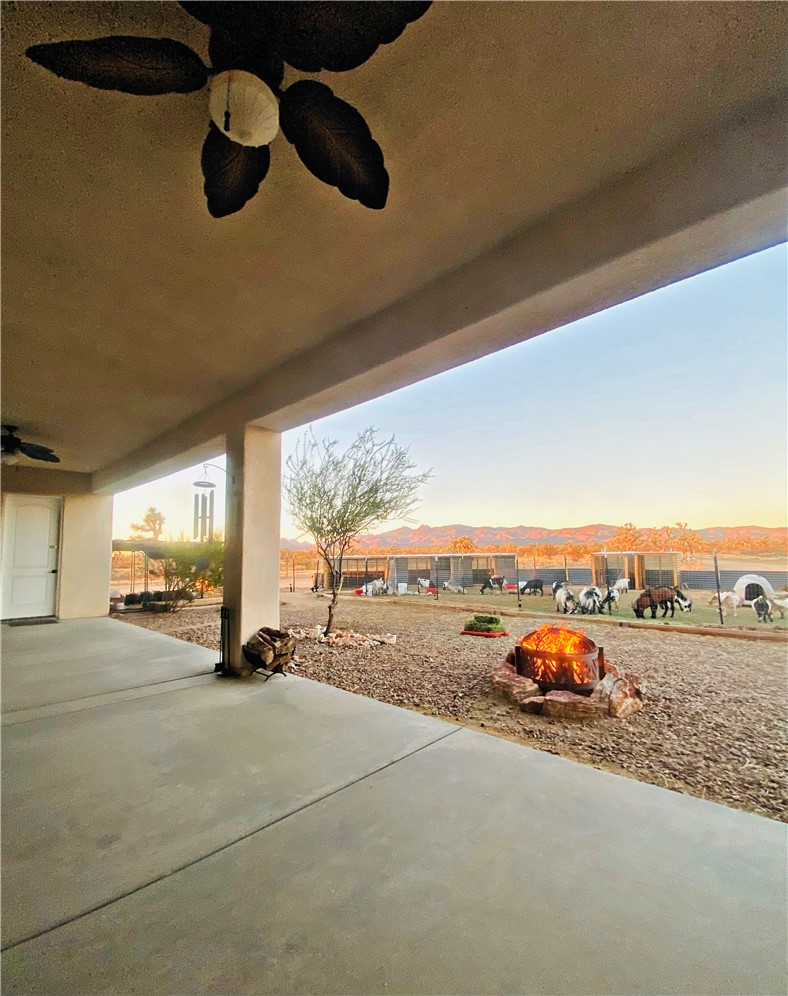 21038 South Cheyenne Road Yucca, AZ 86438 - Photo 66 of 98 Patio terrace at dusk