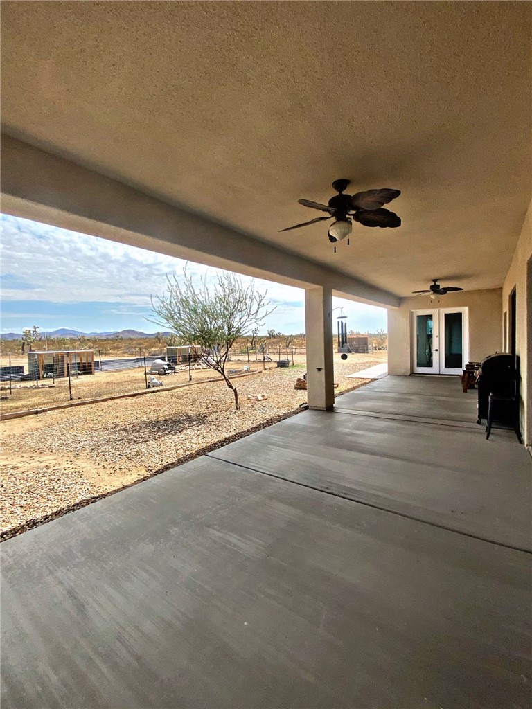 21038 South Cheyenne Road Yucca, AZ 86438 - Photo 68 of 98 View of patio / terrace featuring ceiling fan