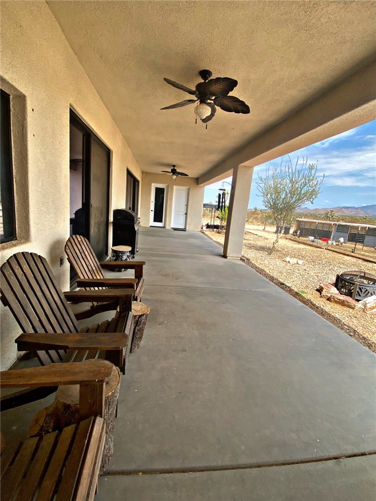 21038 South Cheyenne Road Yucca, AZ 86438 - Photo 69 of 98 View of patio featuring ceiling fan