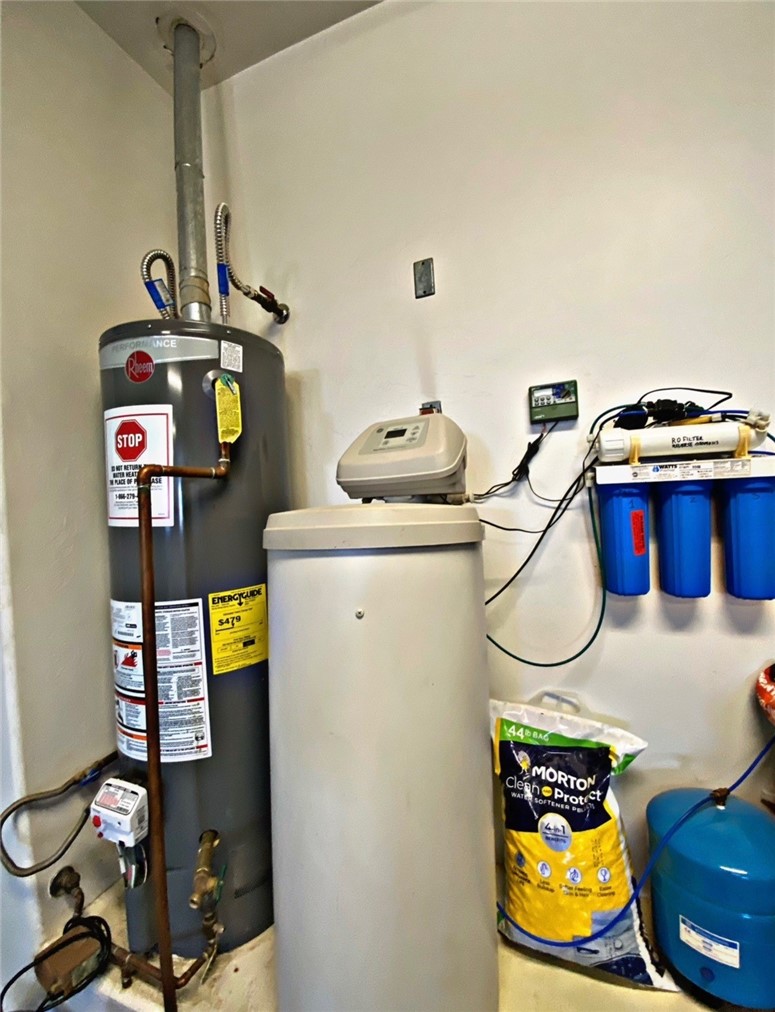 21038 South Cheyenne Road Yucca, AZ 86438 - Photo 97 of 98 Utility room featuring gas water heater