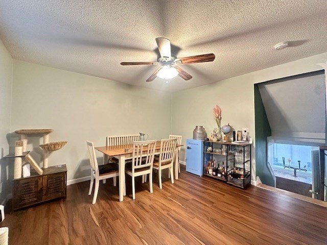 113 Harvard Street, Unit 1 Everett, MA 02149 - Photo 16 of 24 a dining room with furniture and wooden floor