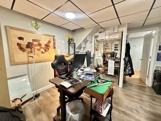 113 Harvard Street, Unit 1 Everett, MA 02149 - Photo 22 of 24 a living room with furniture a flat screen tv and a table