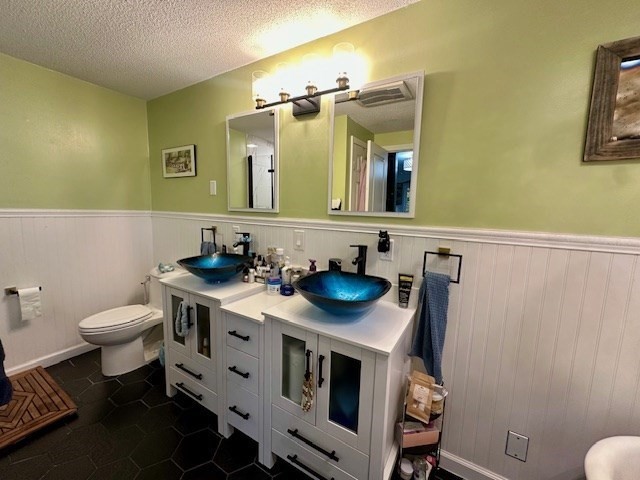 113 Harvard Street, Unit 1 Everett, MA 02149 - Photo 10 of 24 a bathroom with a sink toilet and mirror